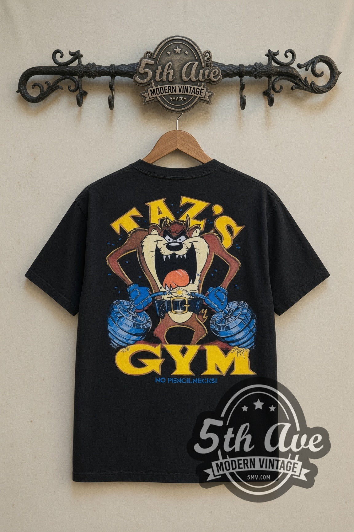 Looney Tunes Taz's Gym No Pencilnecks cartoon tee in black, back view on a display rack