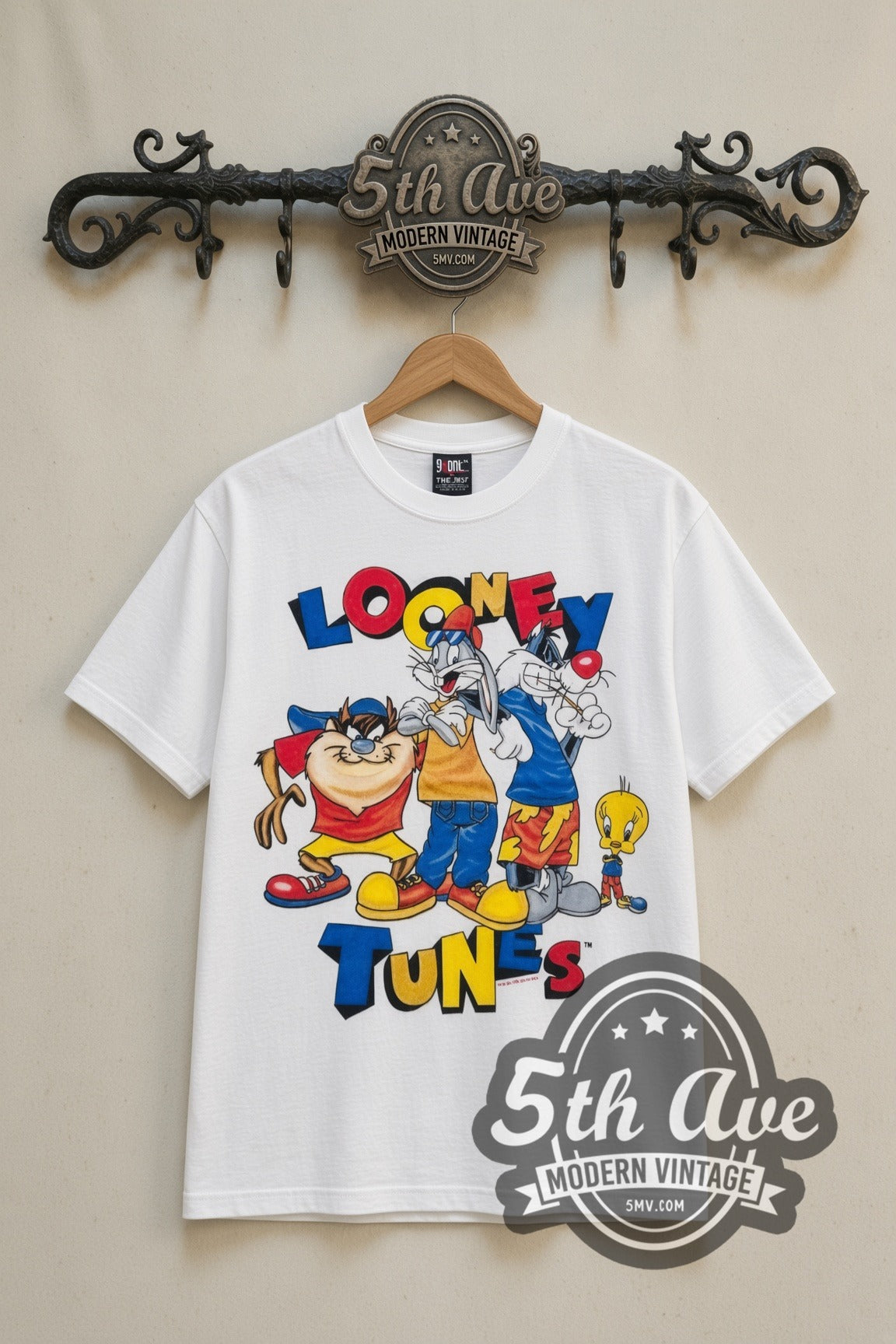 Looney Tunes Tune Squad Group cartoon tee in white, front view on a display rack