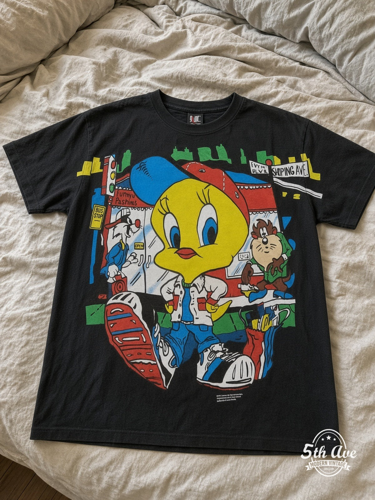 Looney Tunes Tweety Streetwear City vintage tee laid on bed
