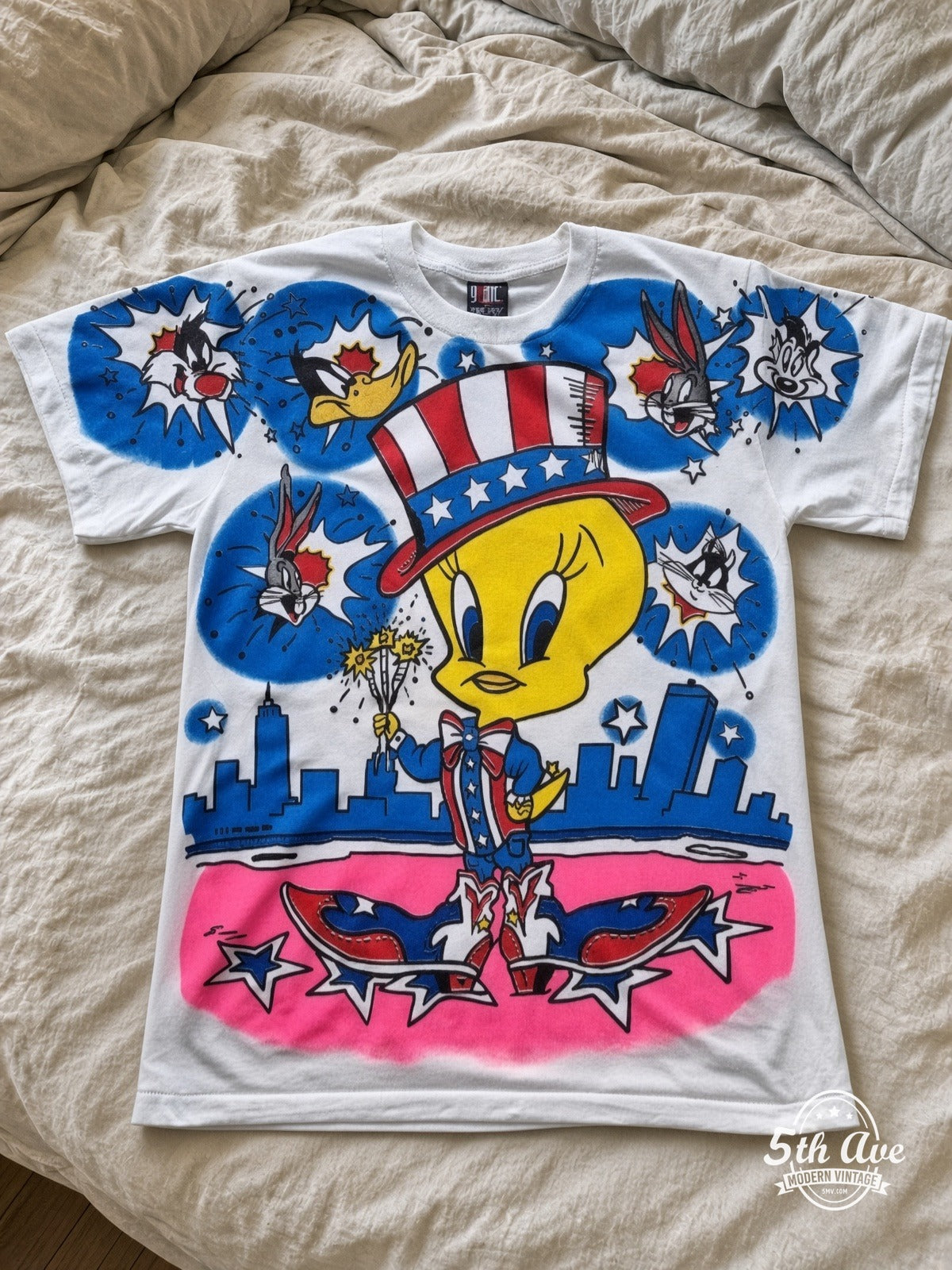 Looney Tunes Tweety Uncle Sam Patriotic vintage tee laid on bed