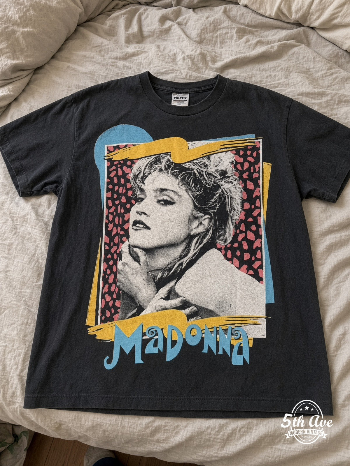 Madonna leopard frame portrait vintage band tee laid on bed