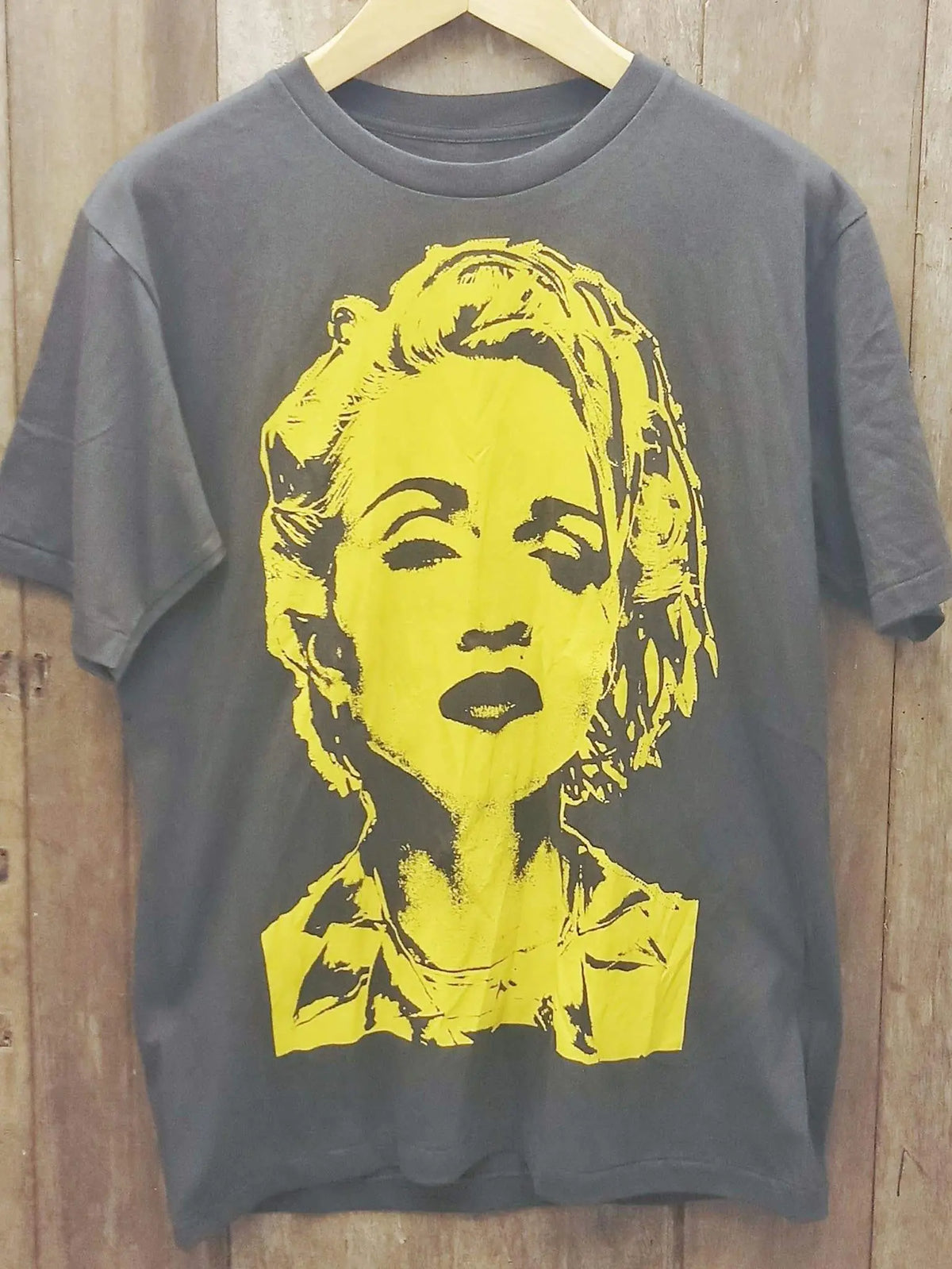 Madonna – Yellow Portrait vintage band t-shirt on rack