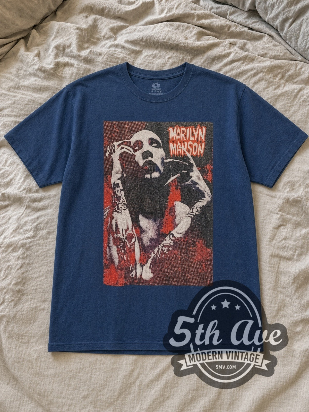Navy Marilyn Manson Halftone Red Portrait Hands Raised Vintage Band T-Shirt laid flat on a linen bed