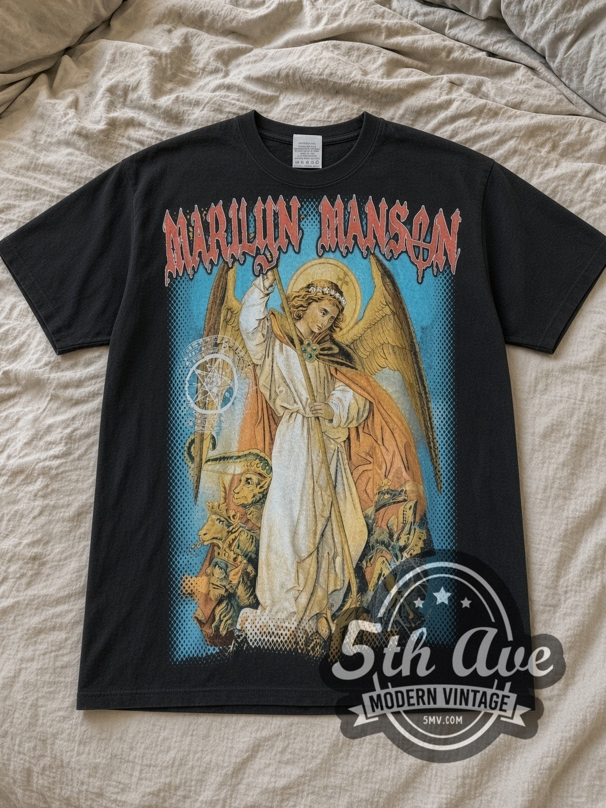 Black Marilyn Manson Angel Spear Demons Sigils Vintage Band T-Shirt laid flat on a linen bed