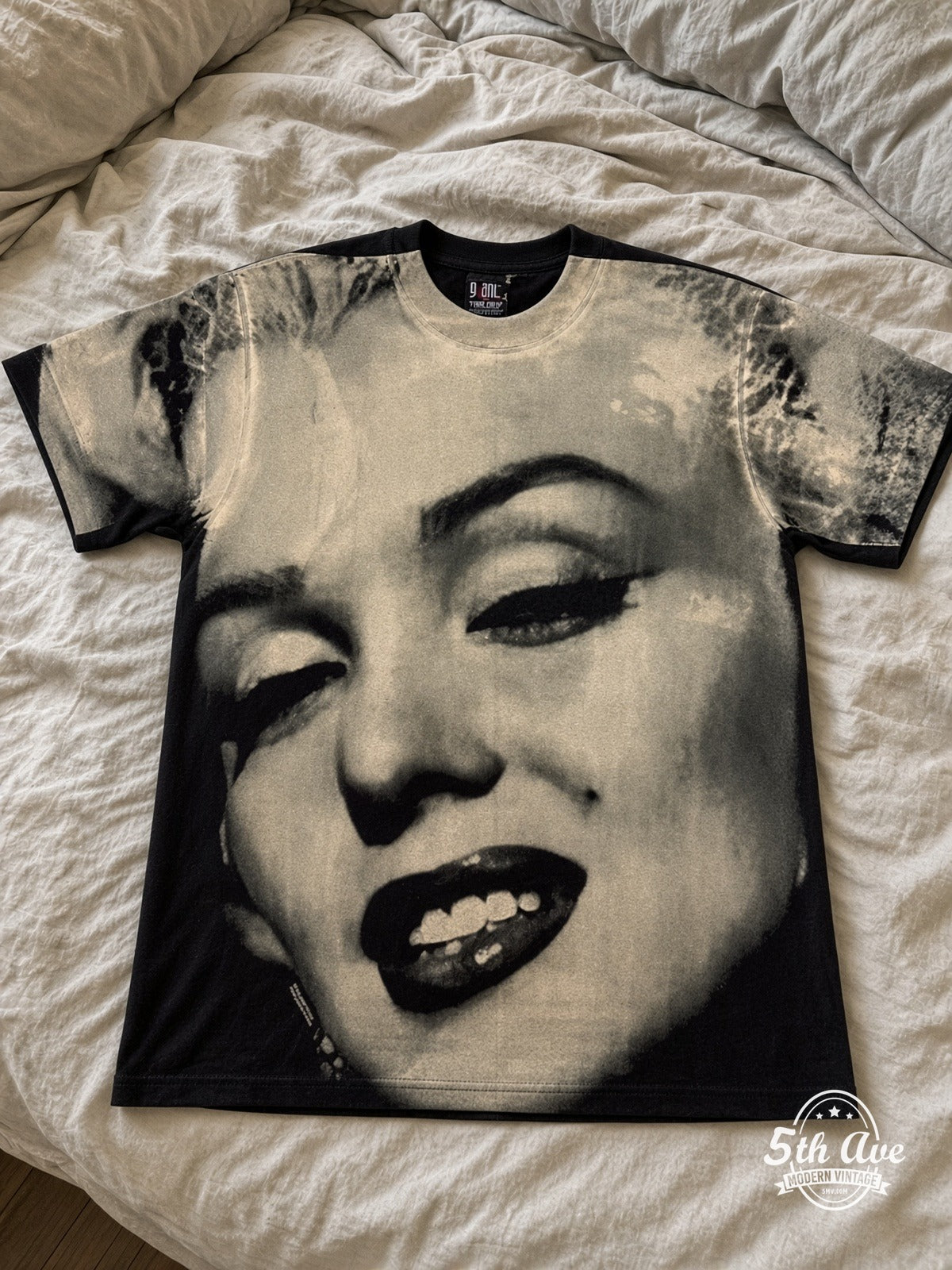 Marilyn Monroe Face Closeup all over print vintage tee laid on bed