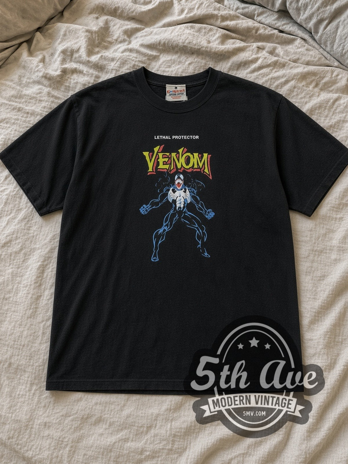 Black Venom Inside Out Graphic Vintage Comic T-Shirt laid flat on a linen bed