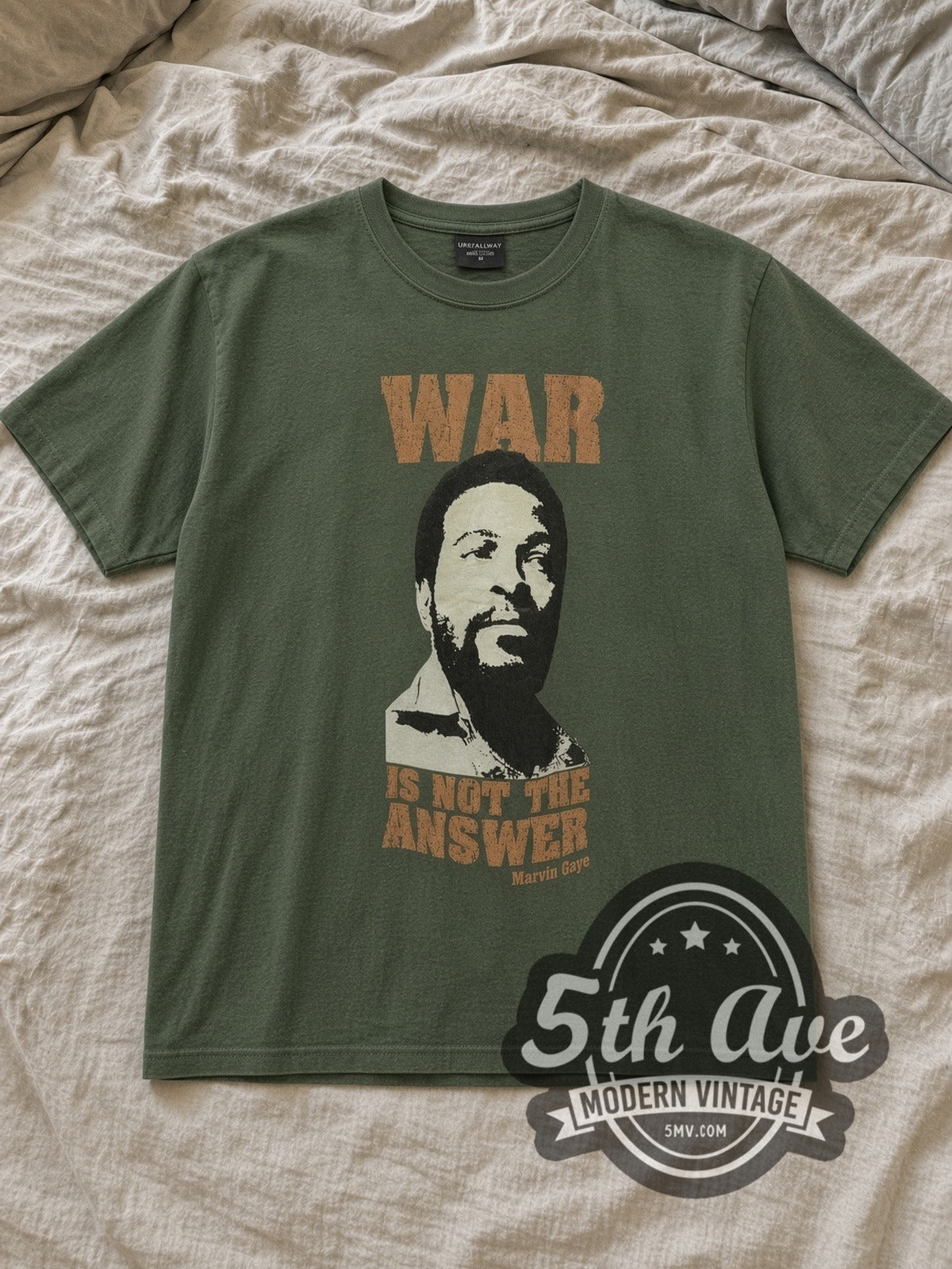 Olive Marvin Gaye Vintage Band T-Shirt laid flat on a linen bed