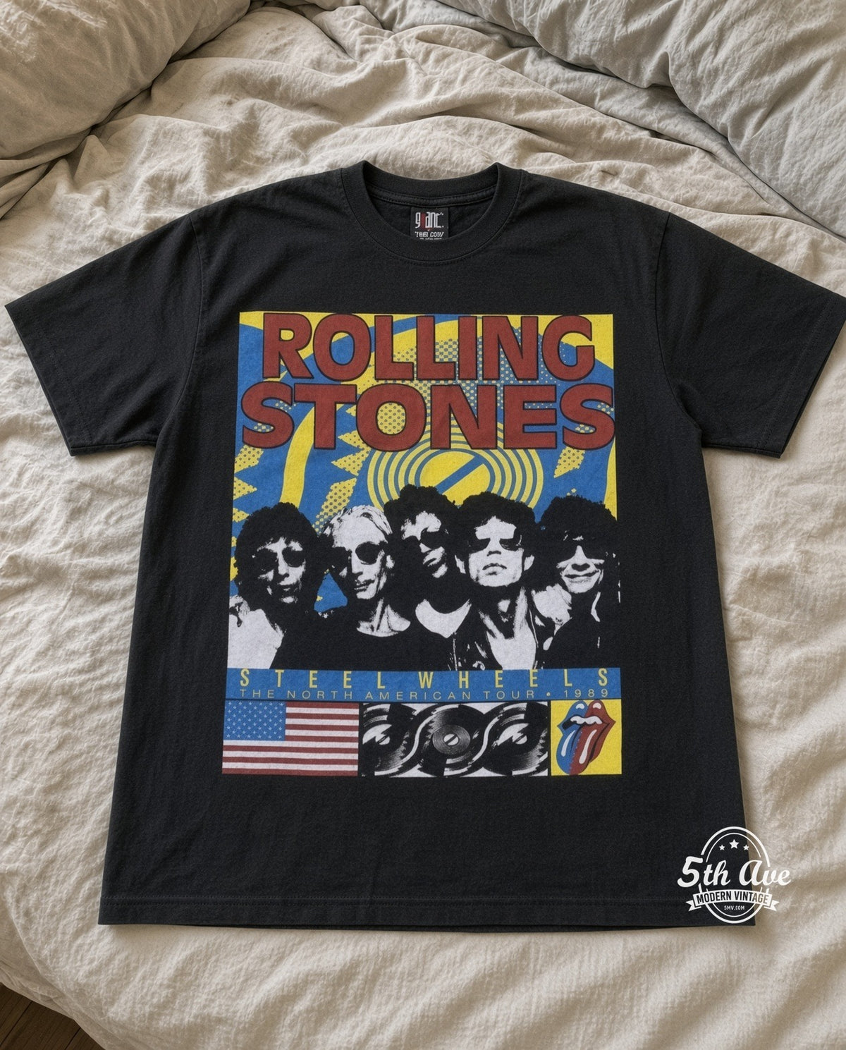 Rolling Stones Steel Wheels Band vintage band t-shirt in black laid flat on a bed, front artwork