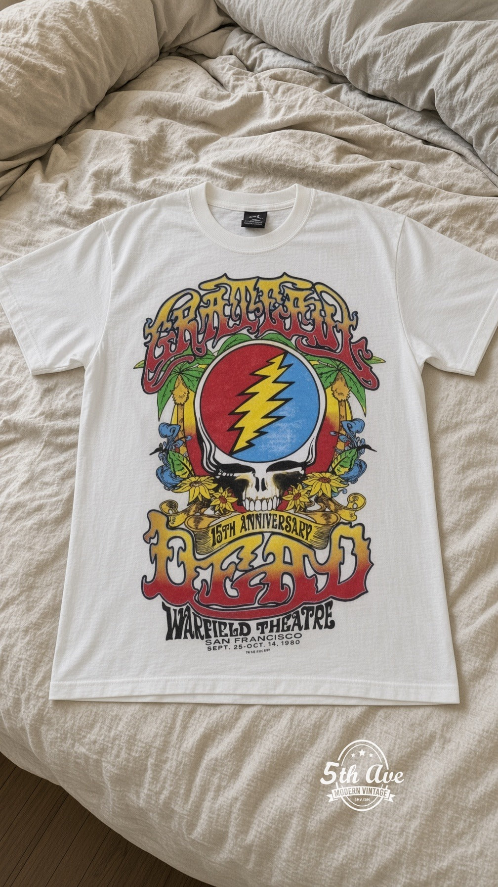 Grateful Dead 15th Anniversary Warfield White vintage tee laid on bed
