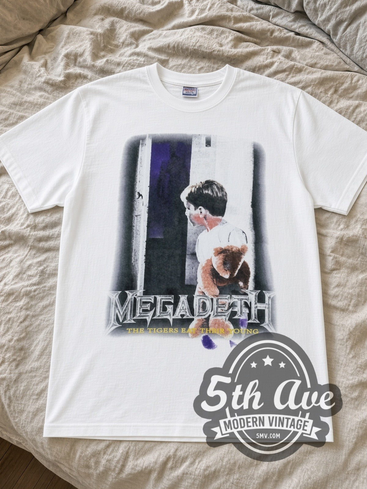 Megadeth Train of Consequences Globe band t-shirt in white laid flat on a bed, front artwork
