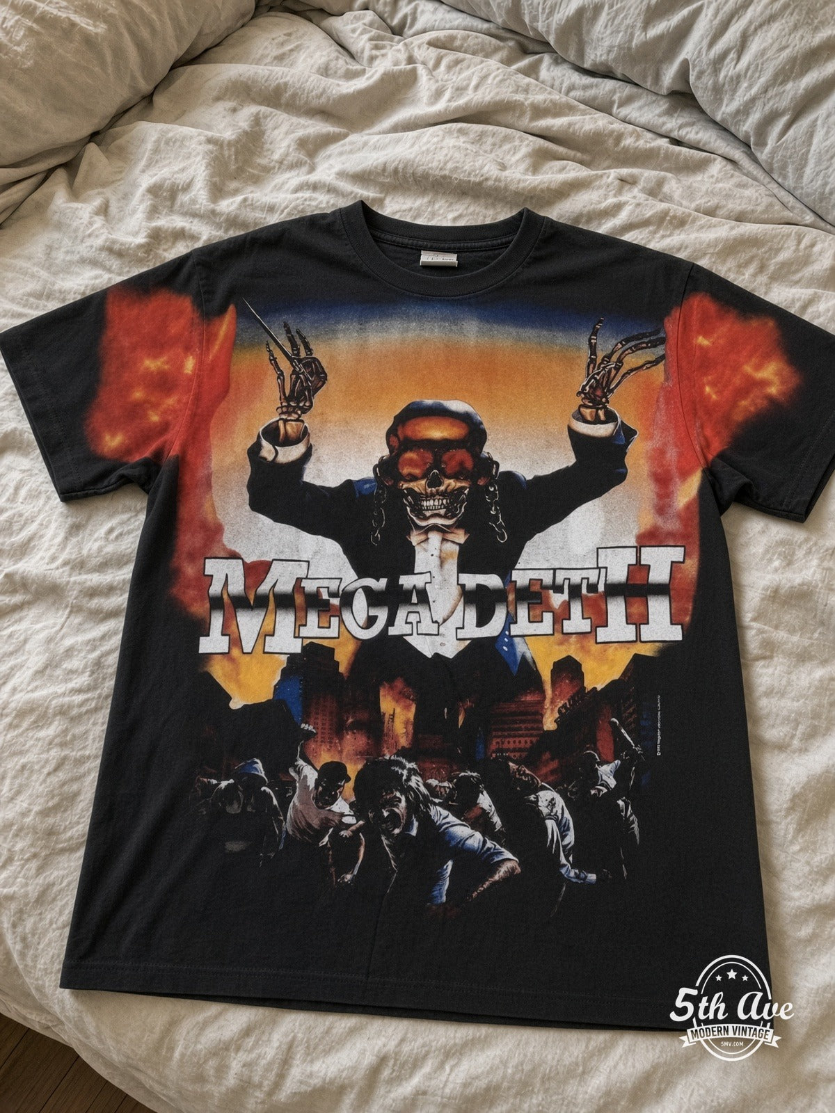 Megadeth Vic Flames Arms Raised all over print vintage tee laid on bed
