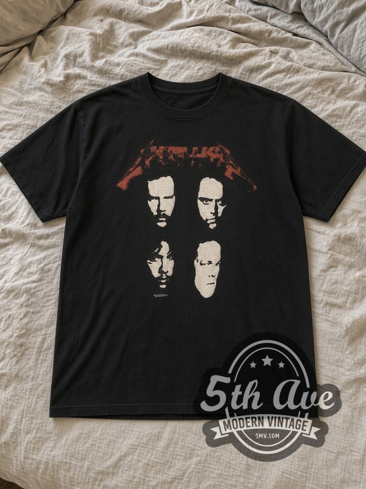 Black Metallica Faces and World Tour 'Don't Tread On Me' Snake Vintage Band T-Shirt laid flat on a linen bed