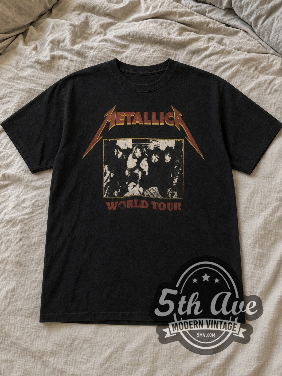 Black Metallica World Tour Band Photo Vintage Band T-Shirt laid flat on a linen bed
