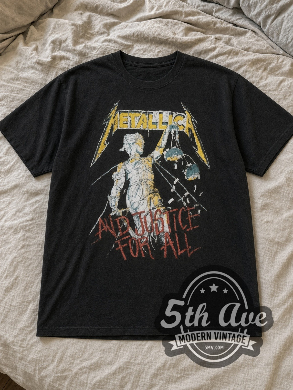 Black Metallica ...And Justice for All World Tour 1989 Vintage Band T-Shirt laid flat on a linen bed