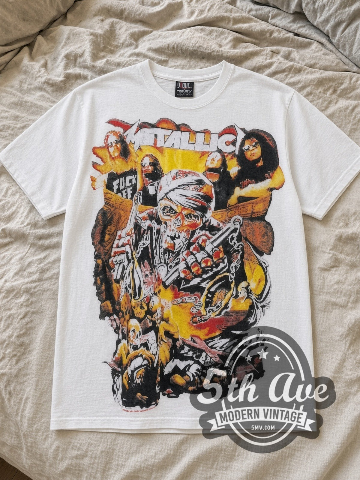 White Metallica Don't Tread on Me All Over Print Vintage Band T-Shirt laid flat on a linen bed