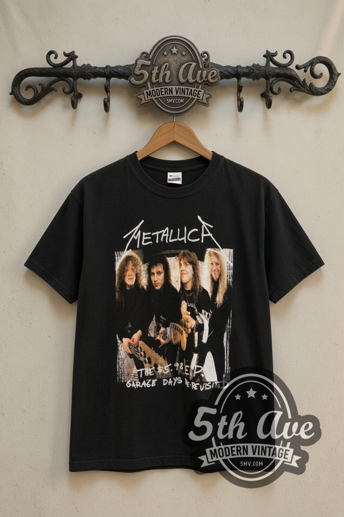 Metallica Garage Days Re-Revisited band t-shirt in black, front view on a display rack