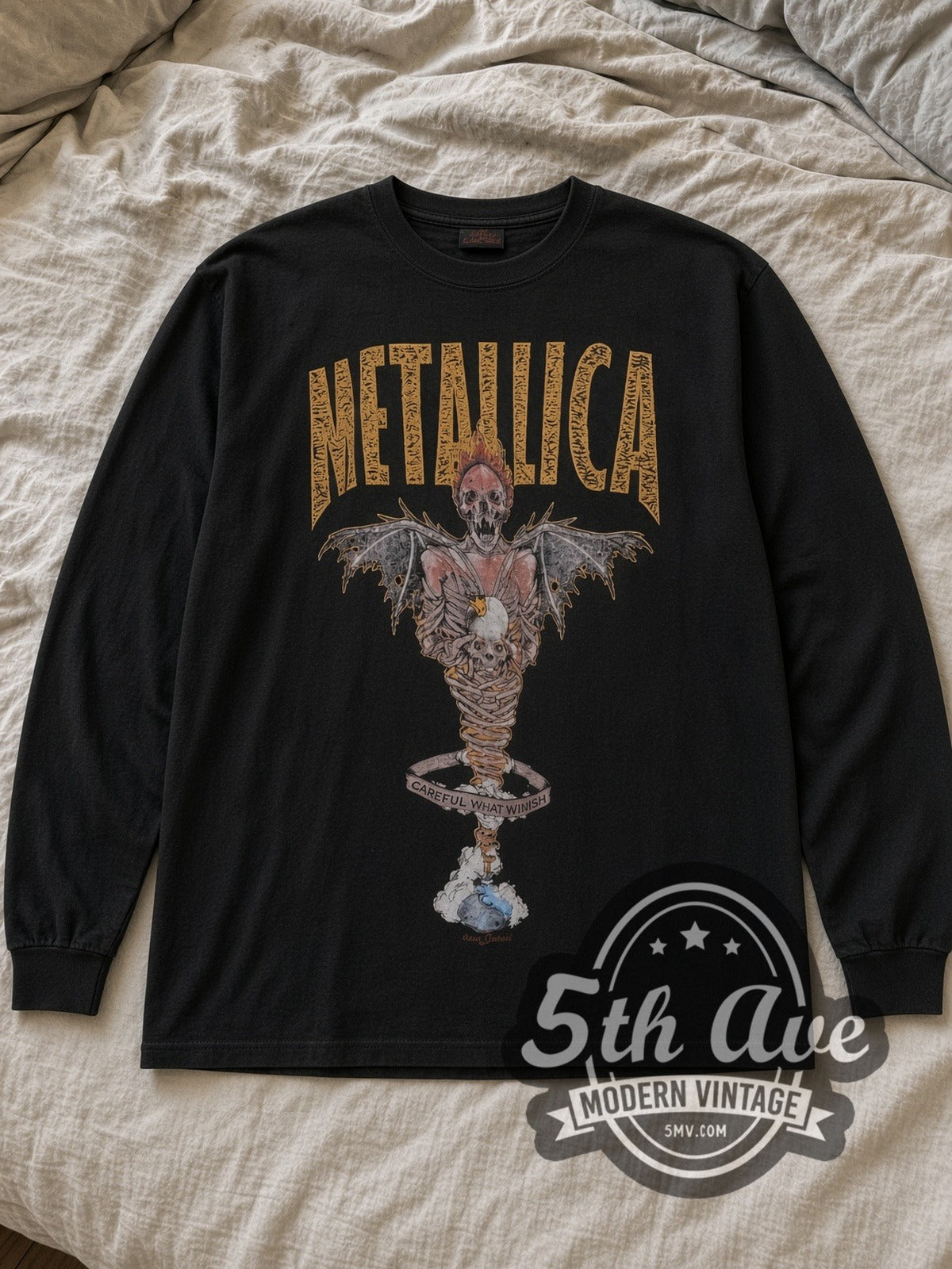 Black Metallica King Nothing Careful What You Wish Vintage Band Long Sleeve T-Shirt laid flat on a linen bed