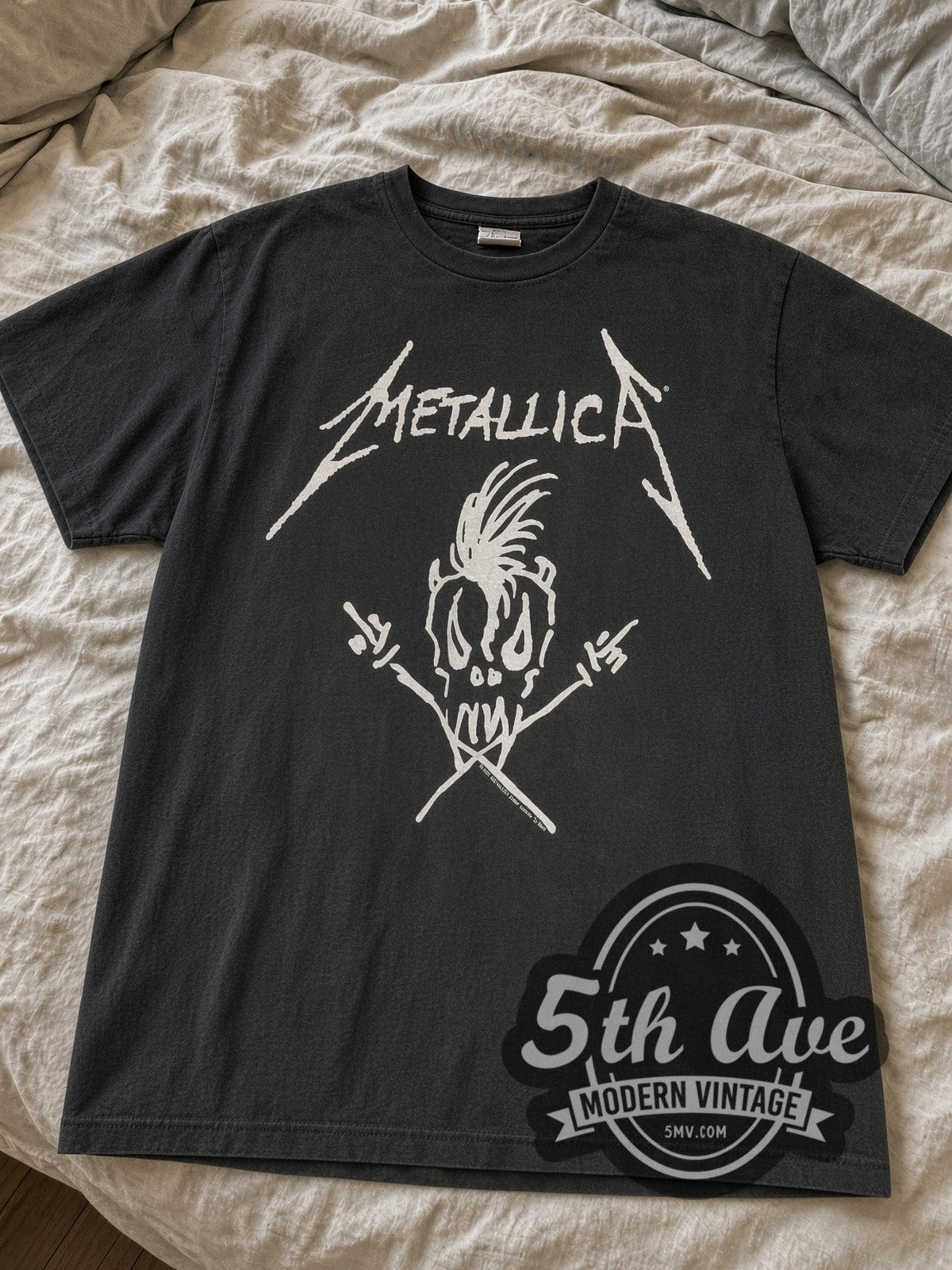 Faded black Metallica Scary Guy Summer Sh*t '94 Tour Map tee laid flat on linen bed