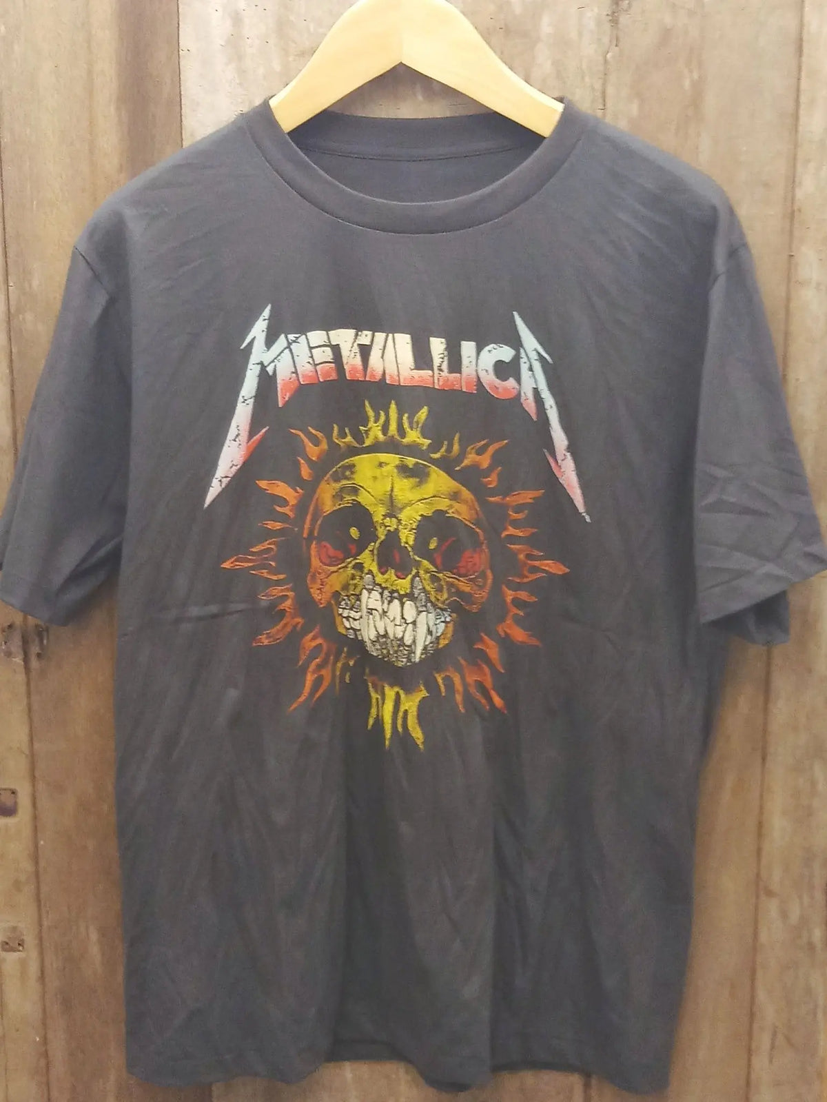 Metallica Skull Sun Flaming Skull Artwork Cotton T-Shirt vintage band t-shirt on rack