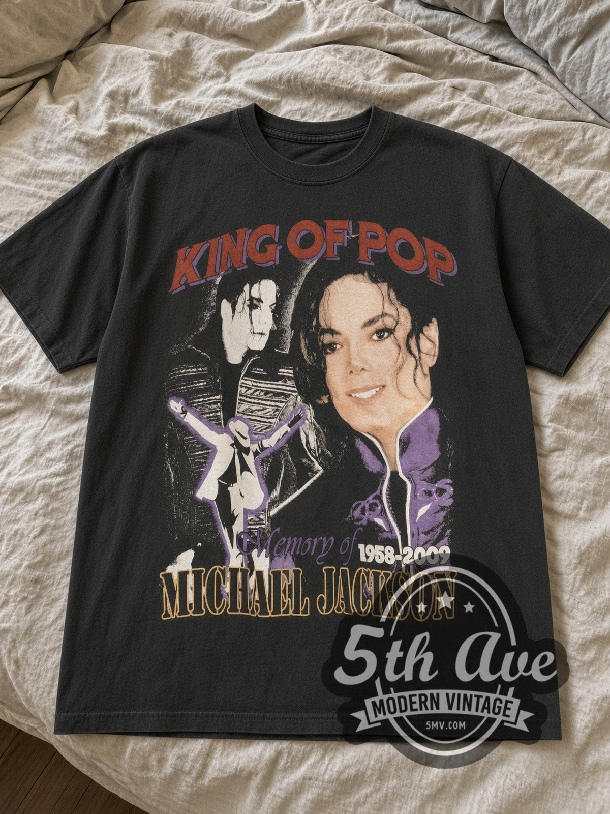 Black Michael Jackson King of Pop tee laid flat on linen bed