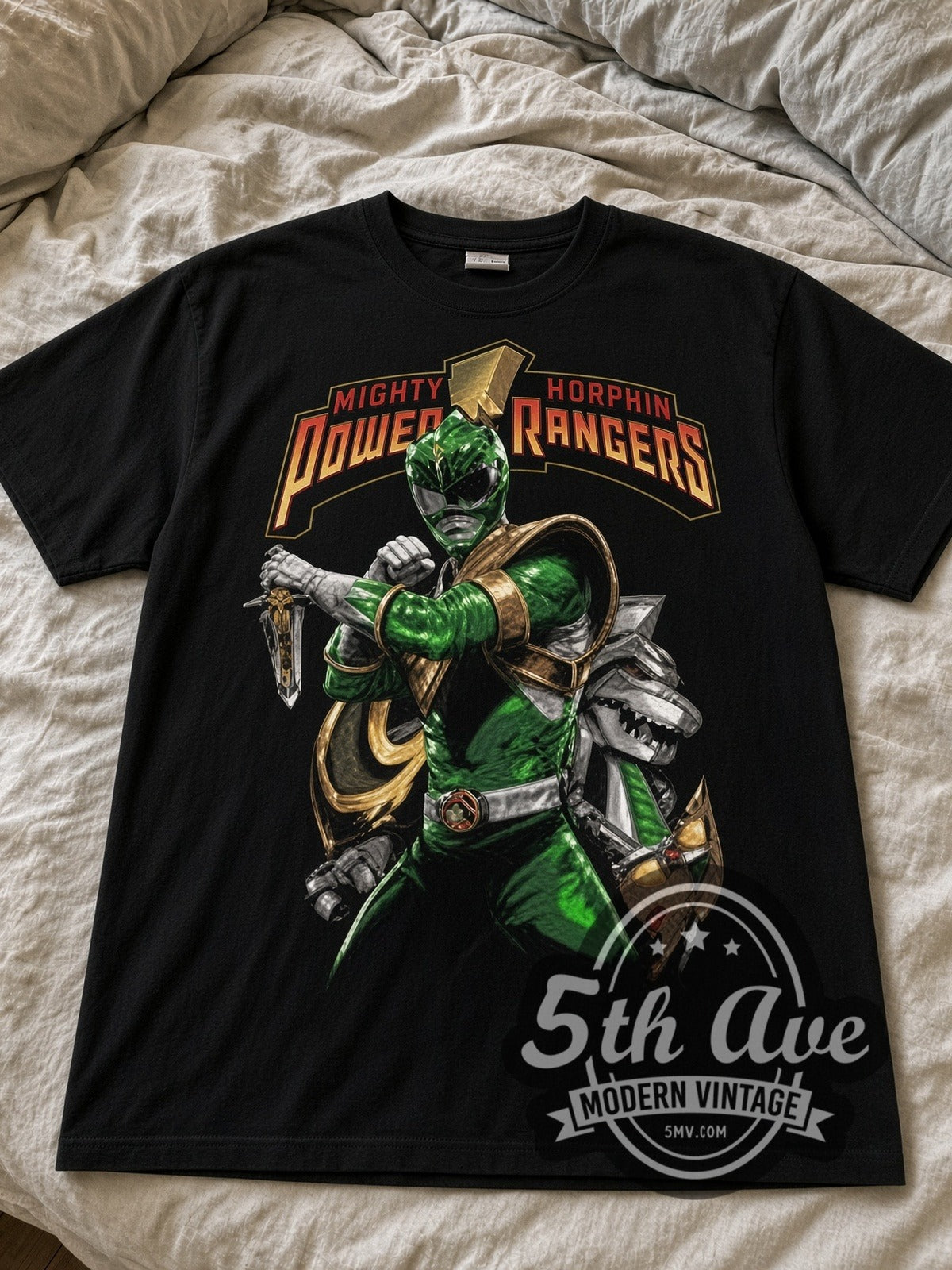 Power Rangers Green Ranger black graphic tee laid flat on linen bed