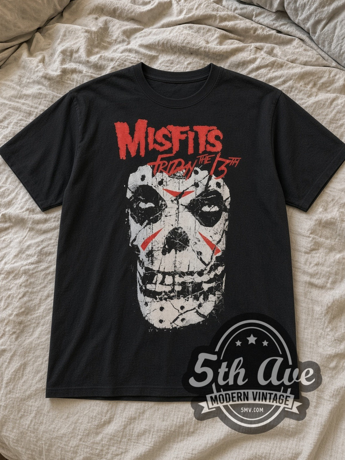 Black Misfits Friday the 13th Vintage Band T-Shirt laid flat on a linen bed