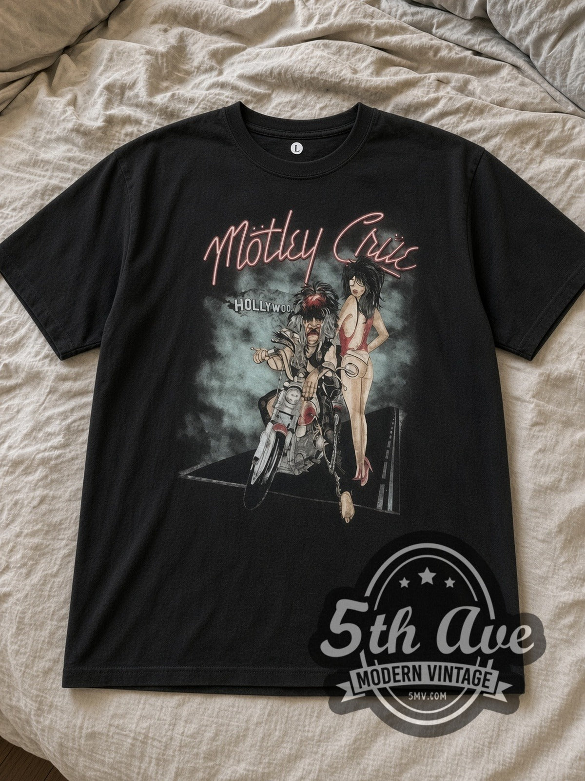 Black Mötley Crüe Motorcycle Graphic Vintage Band T-Shirt laid flat on a linen bed