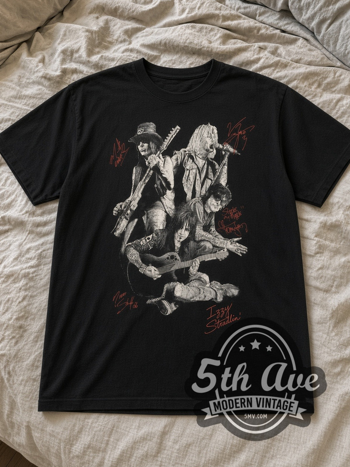Black Mötley Crüe Autographed Members Group Photo Vintage Band T-Shirt laid flat on a linen bed