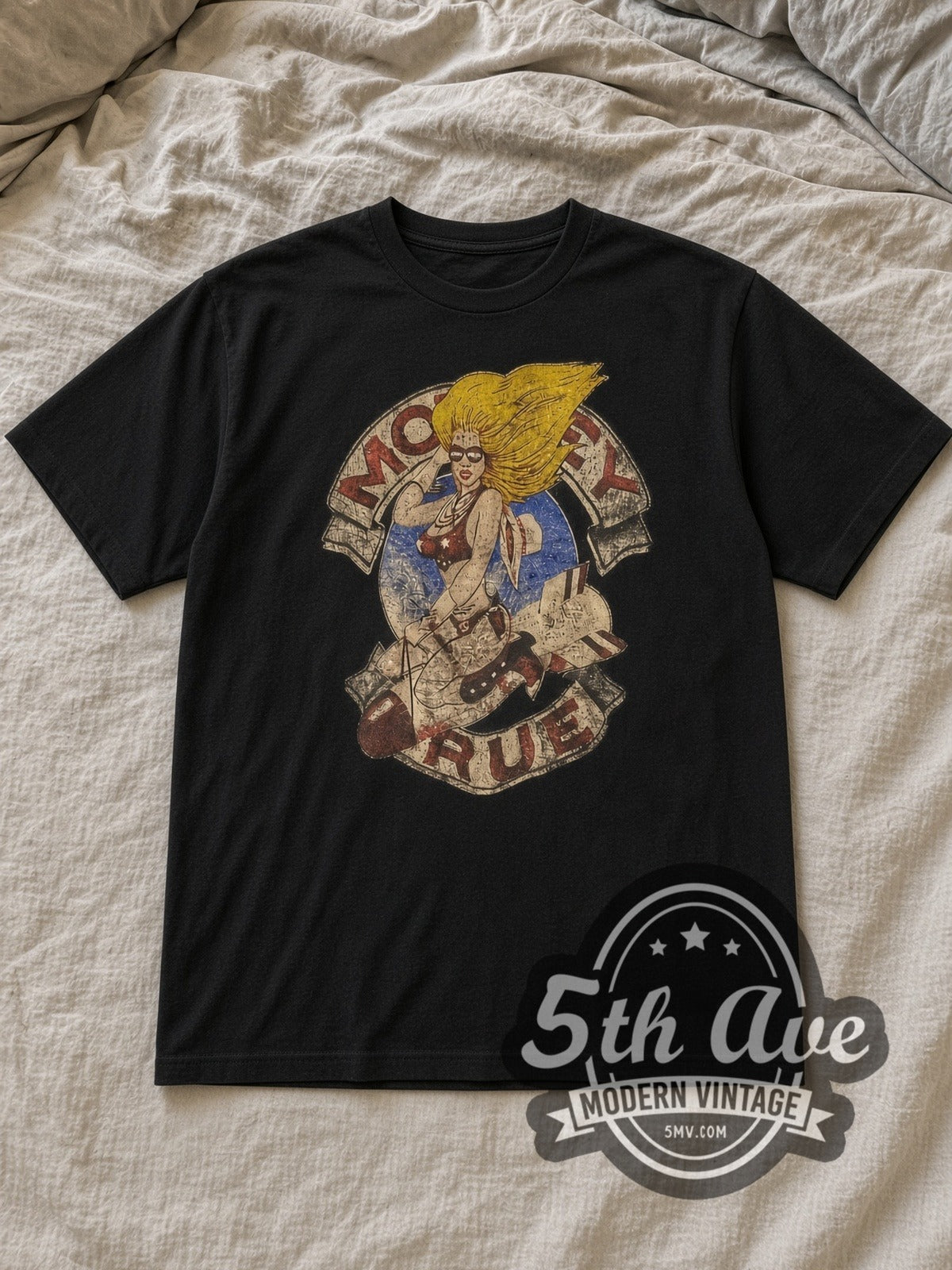 Black Mötley Crüe Girls Girls Girls Tour '87 Vintage Band T-Shirt laid flat on a linen bed