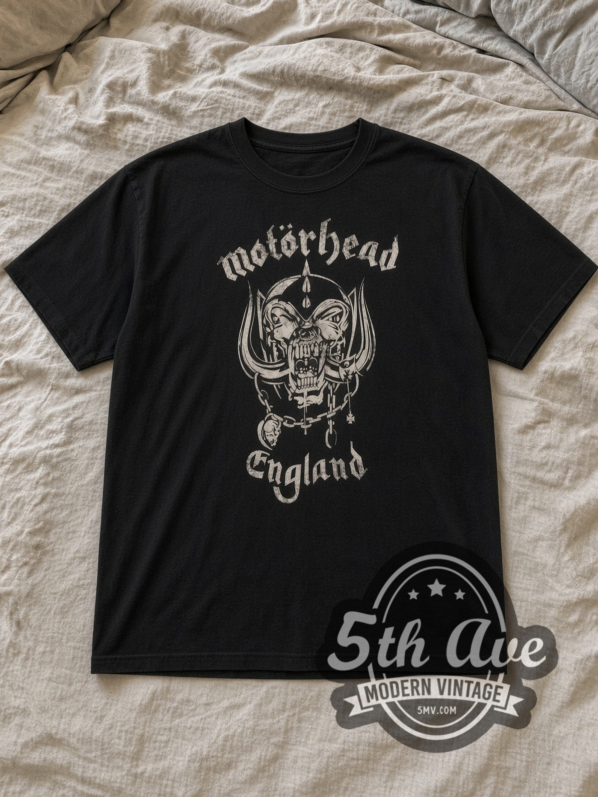 Black Motörhead Everything Louder Than Everything Else Vintage Band T-Shirt laid flat on a linen bed