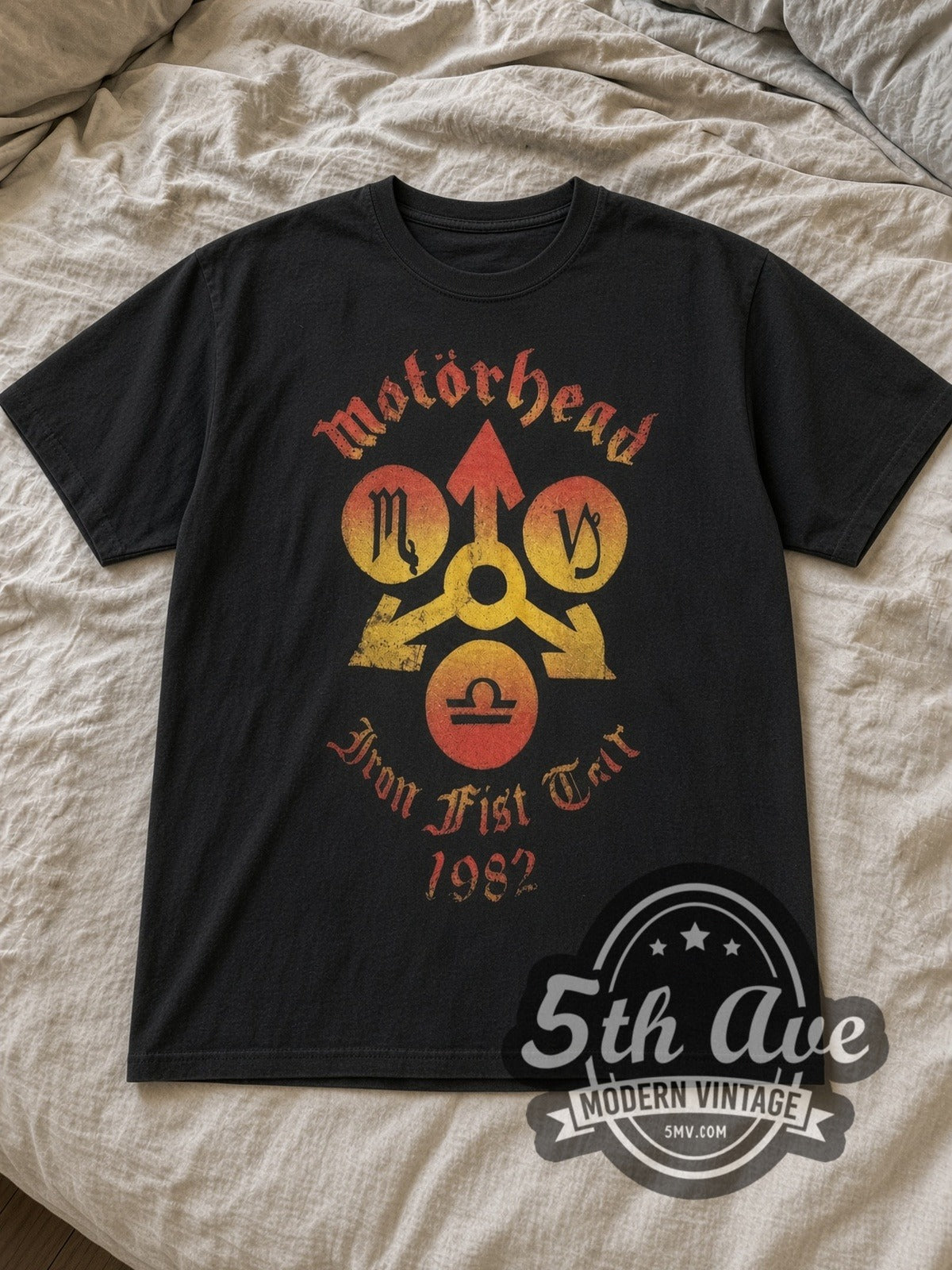 Black Motörhead Iron Fist Tour 1982 Vintage Band T-Shirt laid flat on a linen bed