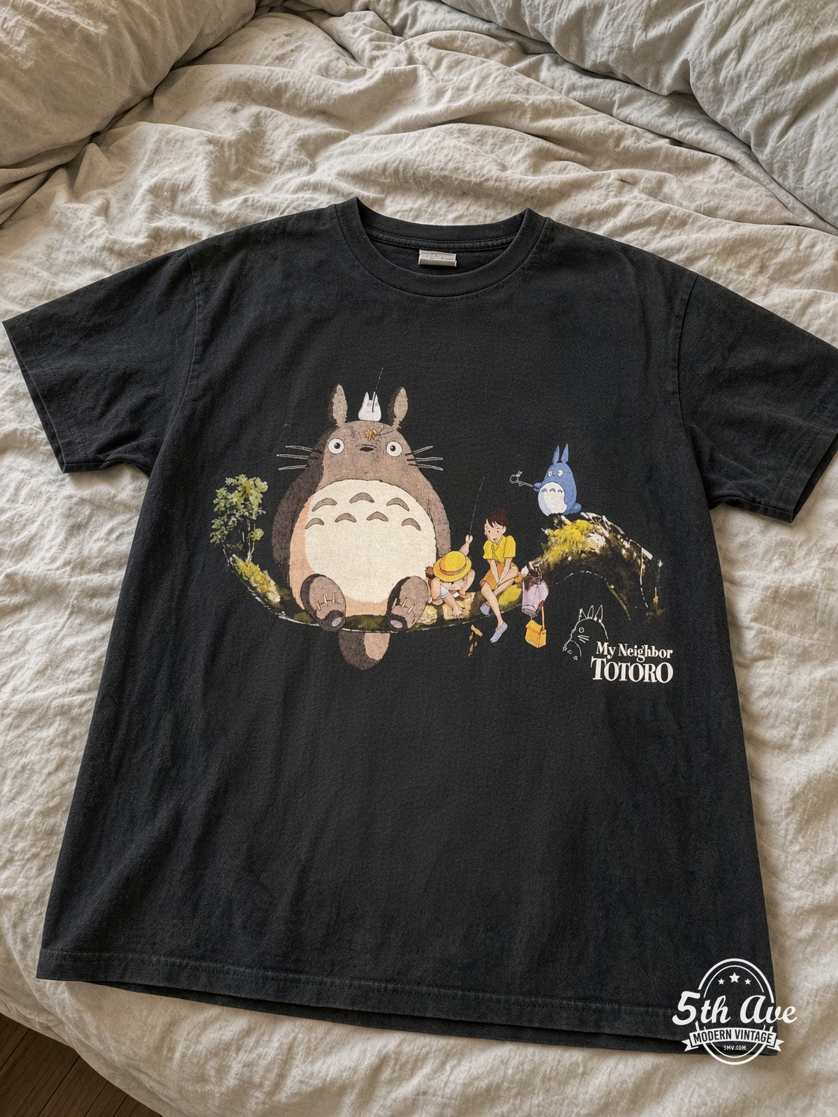 My Neighbor Totoro Tree Branch vintage tee laid on bed