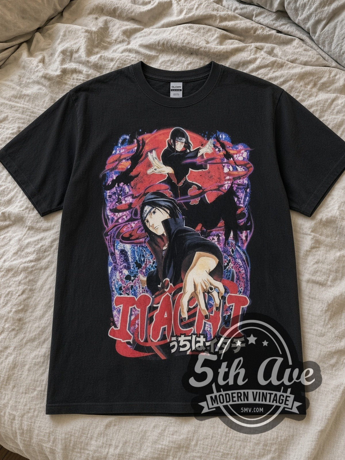 Black Naruto Shippuden Itachi Uchiha All Over Print Vintage Anime T-Shirt laid flat on a linen bed