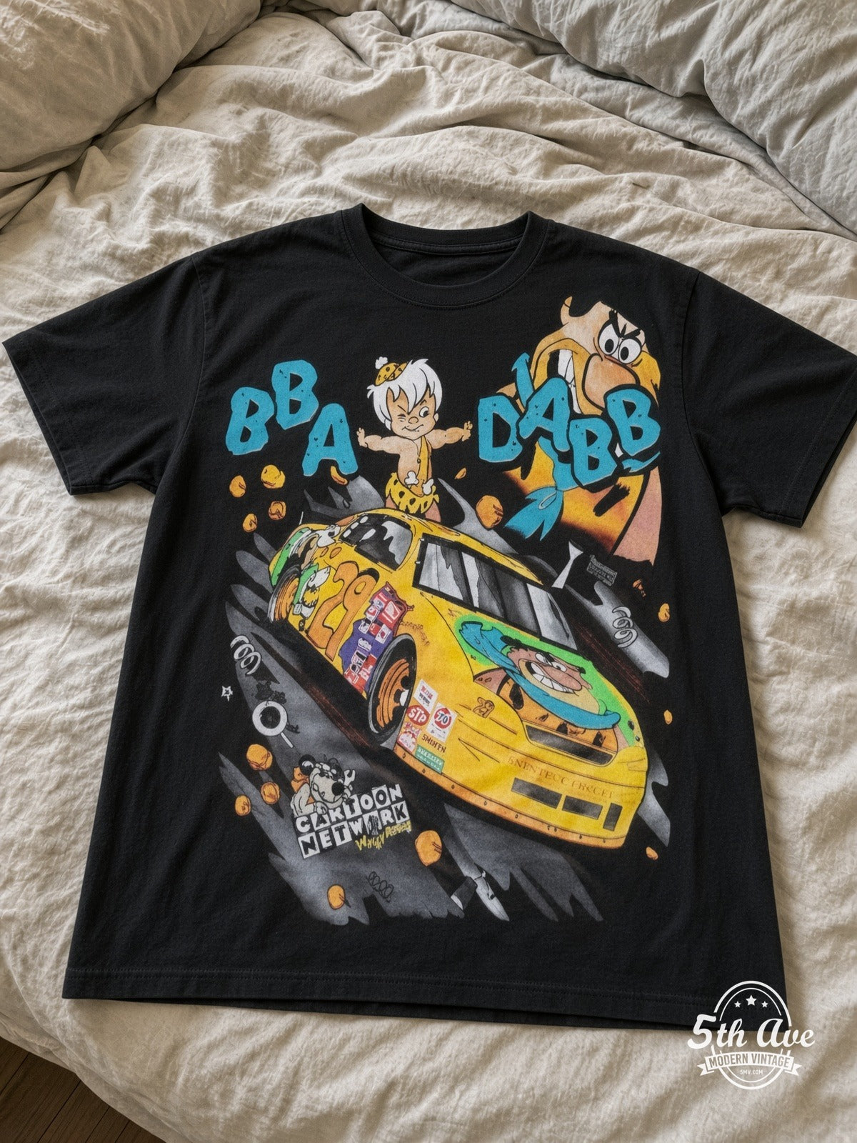 NASCAR Flintstones Yabba Dabba Doo Racing vintage tee laid on bed