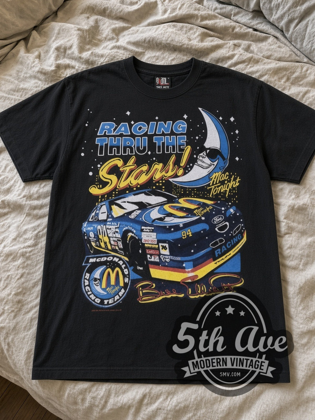 NASCAR McDonald's Racing Mac Tonight nascar tee in black laid flat on a bed, front artwork
