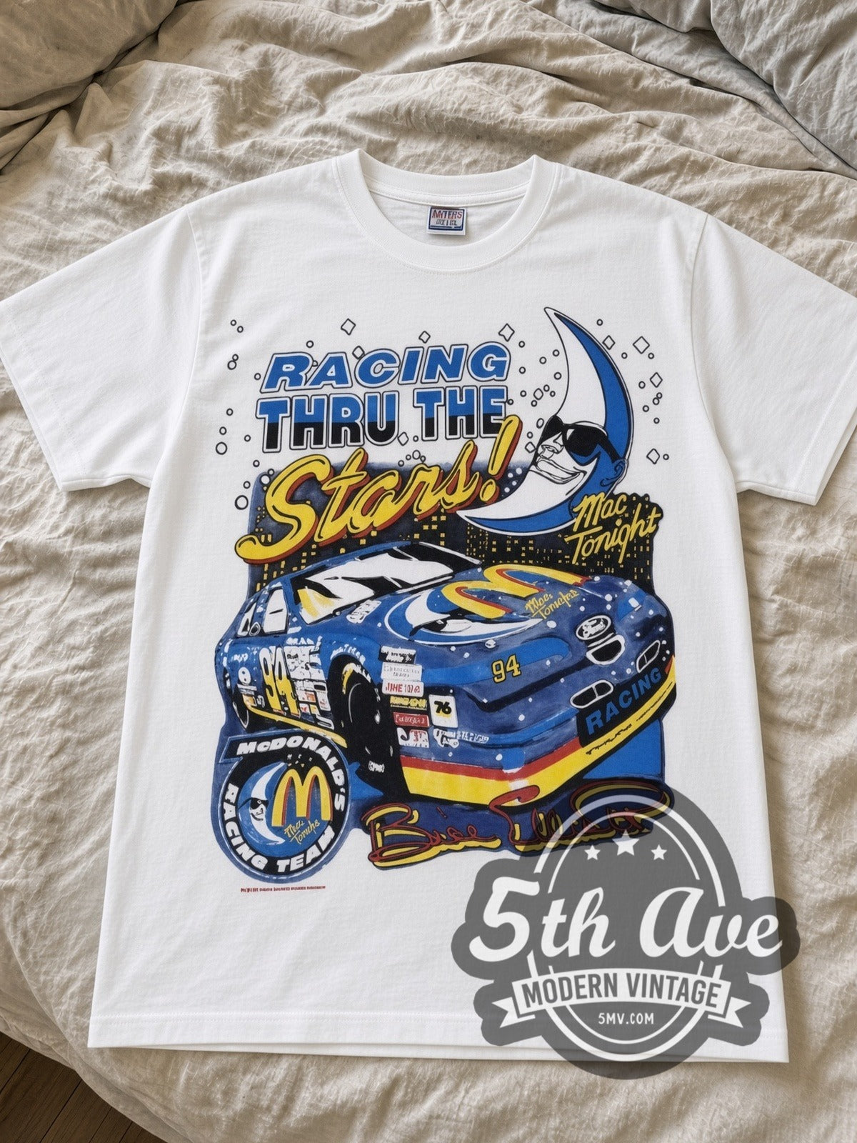 NASCAR McDonald's Racing Mac Tonight nascar tee in white laid flat on a bed, front artwork