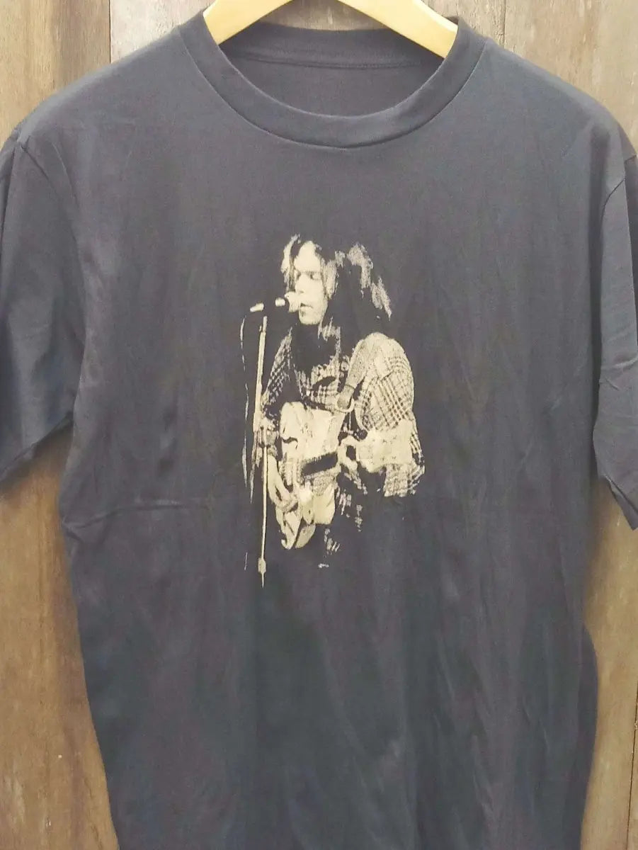 Neil Young Black-and-White Performance T-Shirt with Captain Boot Tag: A Timeless Piece of Rock 'n' Roll History - Vintage Band Shirts