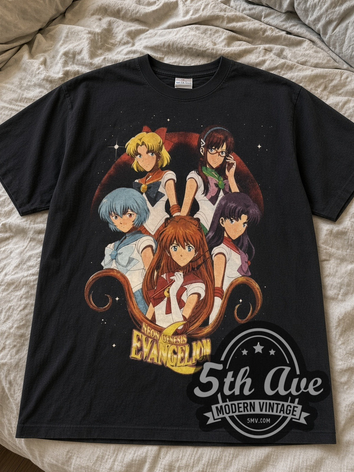 Black Neon Genesis Evangelion Sailor Girls & Asuka Panels tee laid flat on linen bed