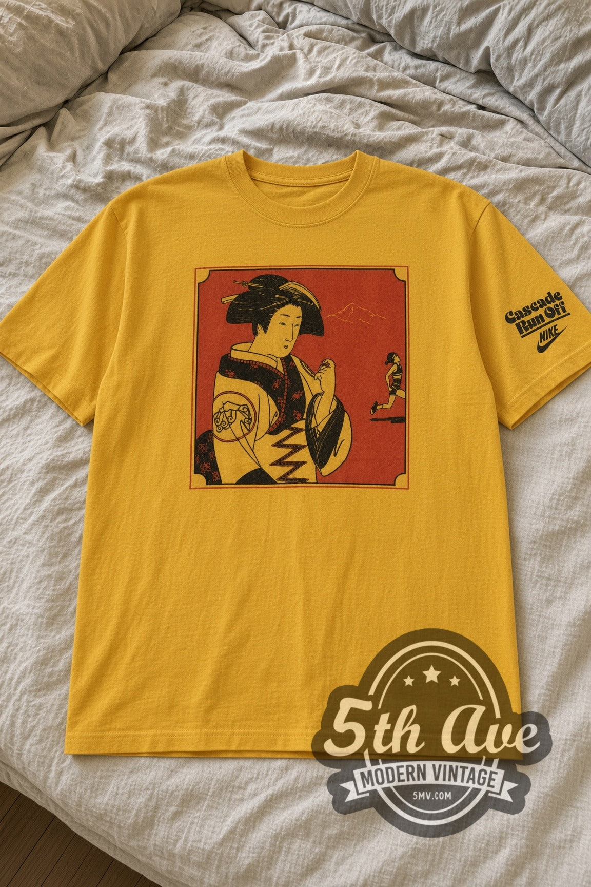 Nike Cascade Run Off Geisha Panel Gold vintage graphic tee laid flat on bed