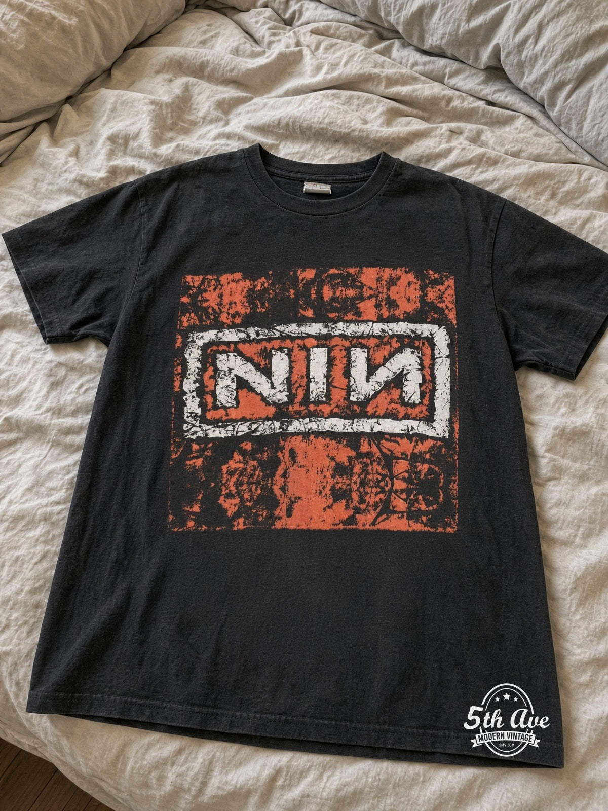 Nine Inch Nails In Concert Trent Crouch vintage tee laid on bed