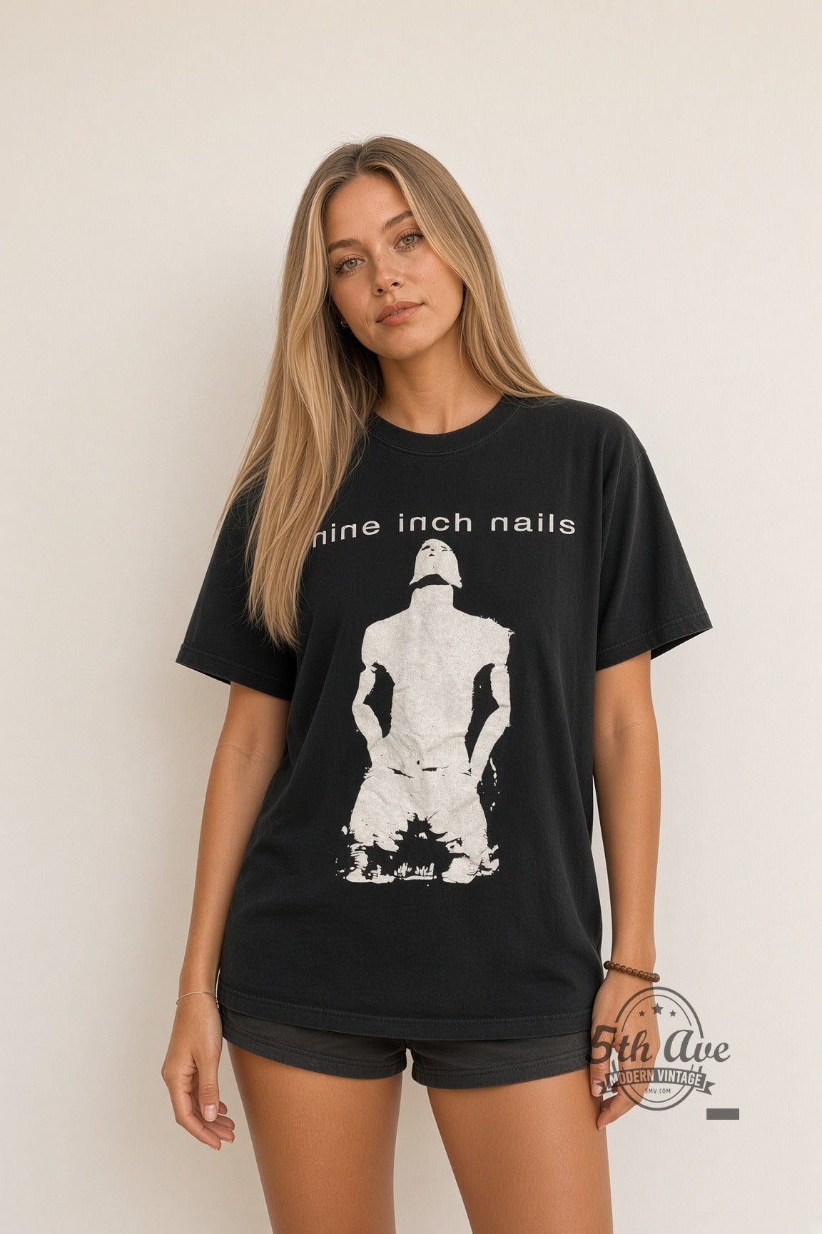 Model wearing Nine Inch Nails Kneeling Figure NIN Logo vintage band t-shirt