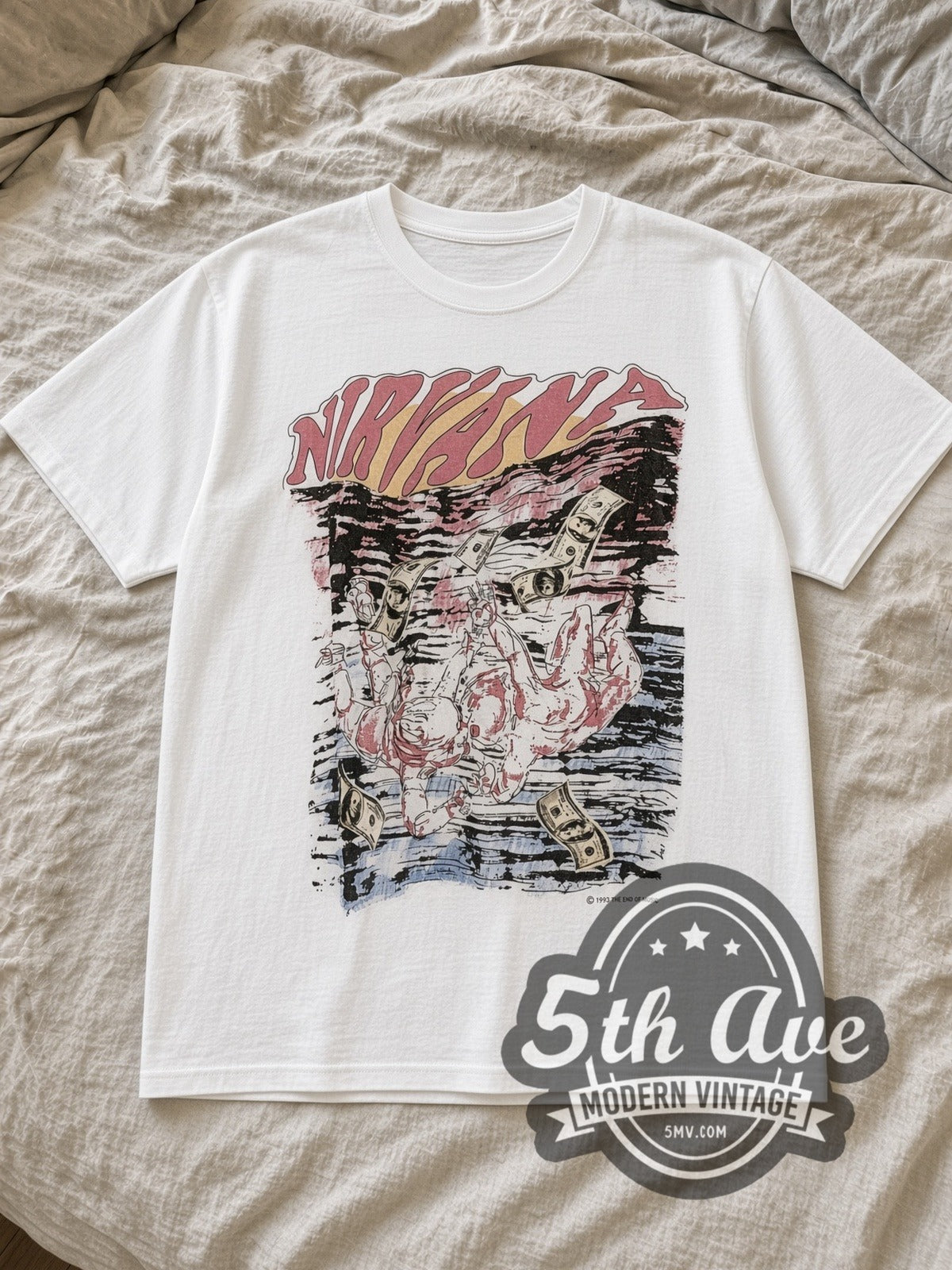 White Nirvana Nevermind Sketch Dollar Bills 1993 Vintage Band T-Shirt laid flat on a linen bed