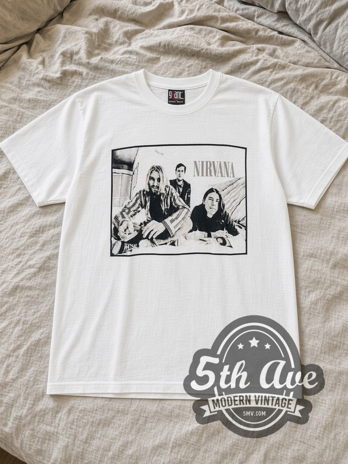 White Nirvana Band Photo Kurt Plaid Portrait Vintage Band T-Shirt laid flat on a linen bed