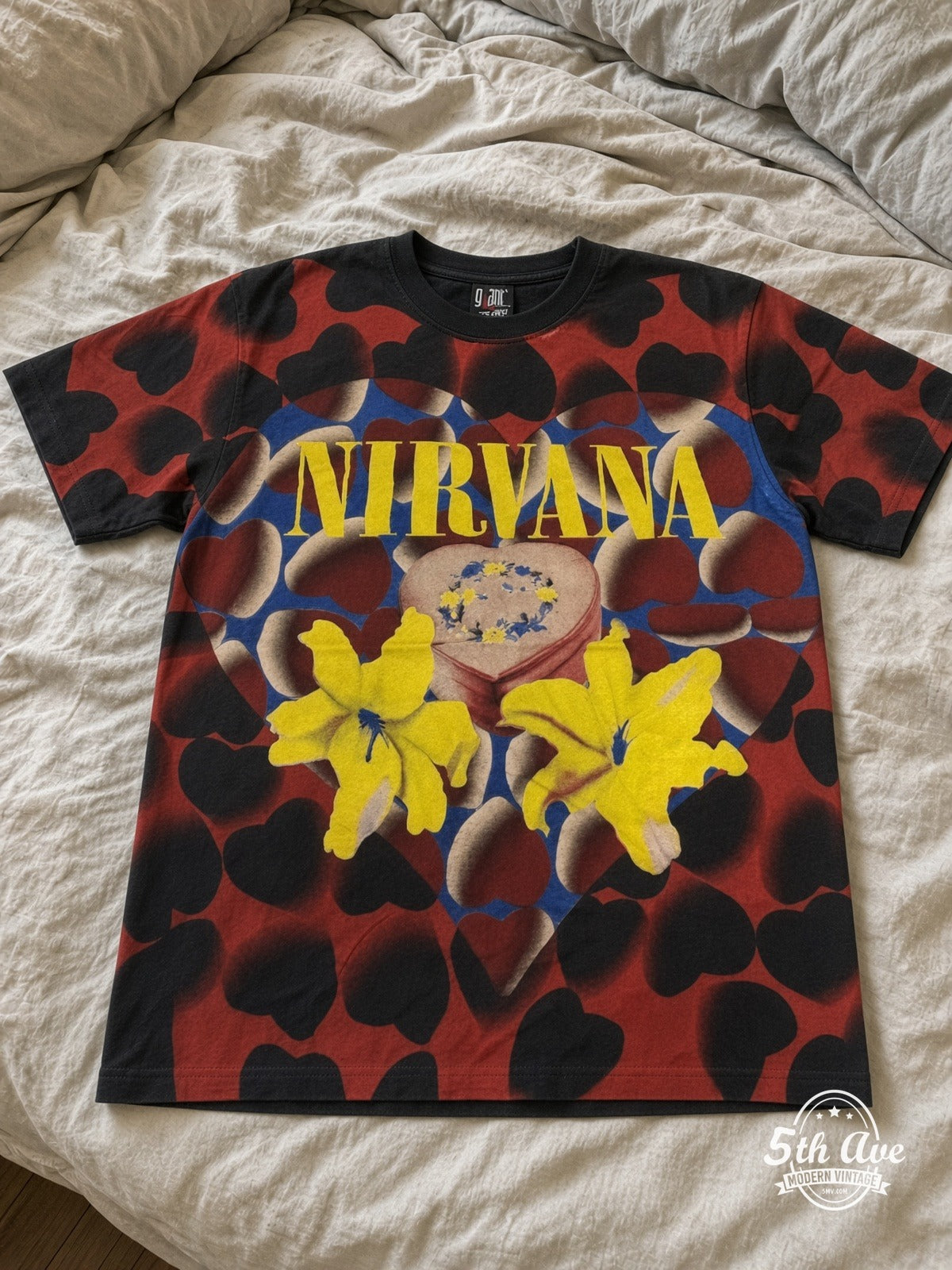 Nirvana Heart Lilies all over print vintage tee laid on bed