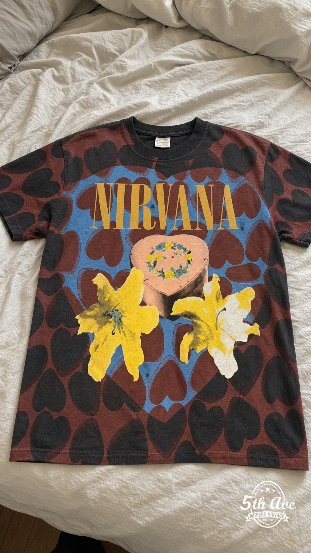 Nirvana vintage t-shirt laid on bed