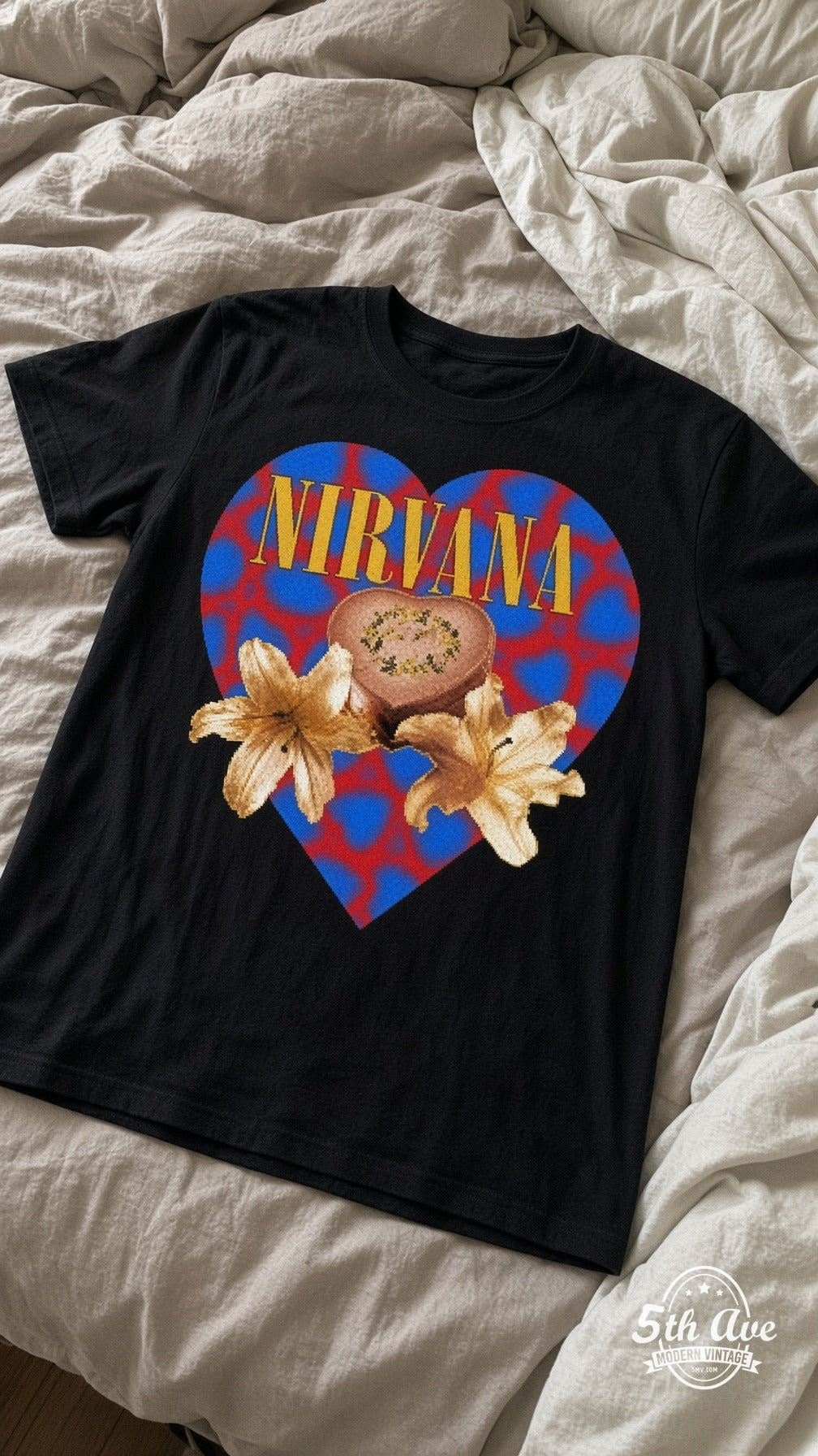 Nirvana Heart-Shaped Box vintage t-shirt laid on bed