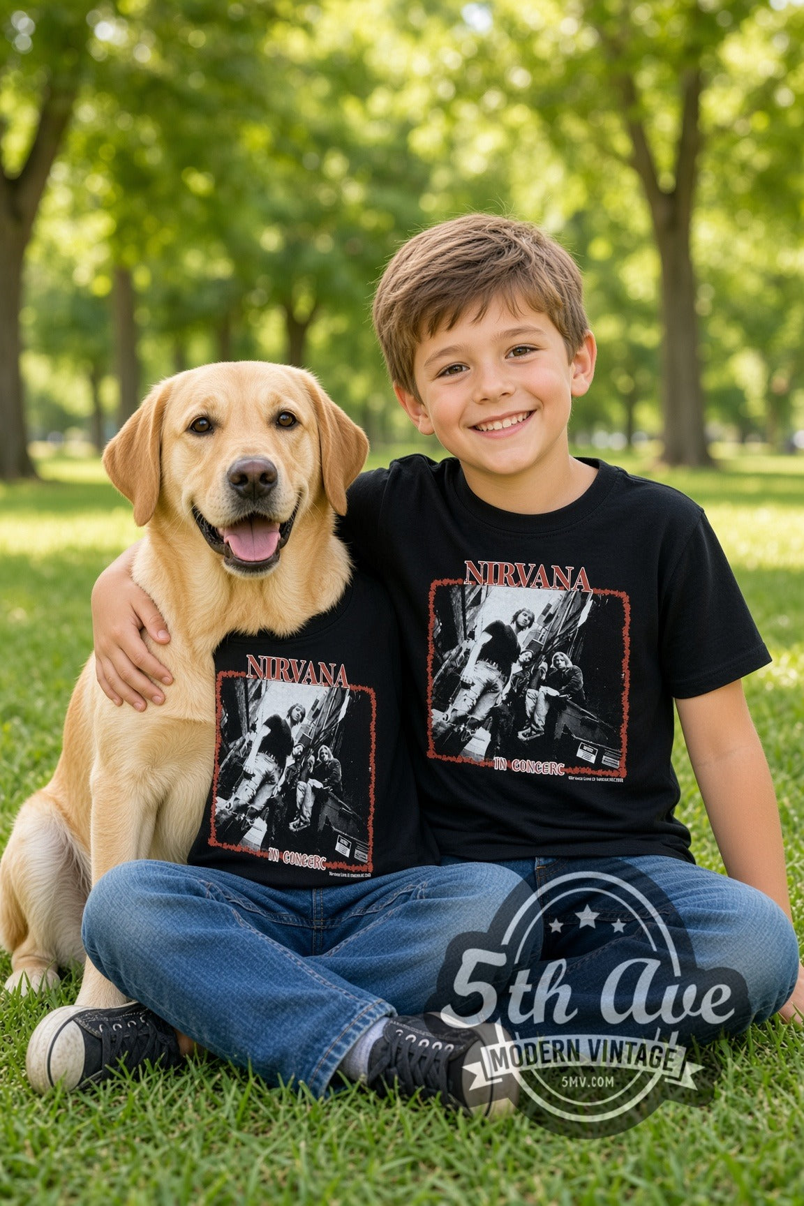 Child and dog both wearing the Nirvana In Concert Band Photo kids band tee in black