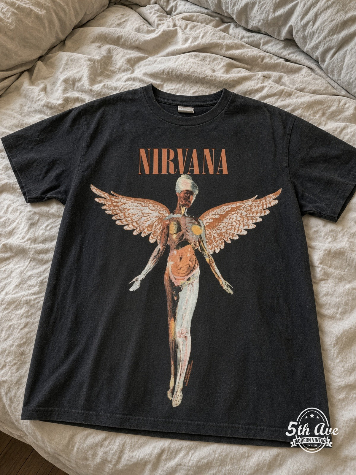 Nirvana In Utero Anatomical Angel vintage tee laid on bed