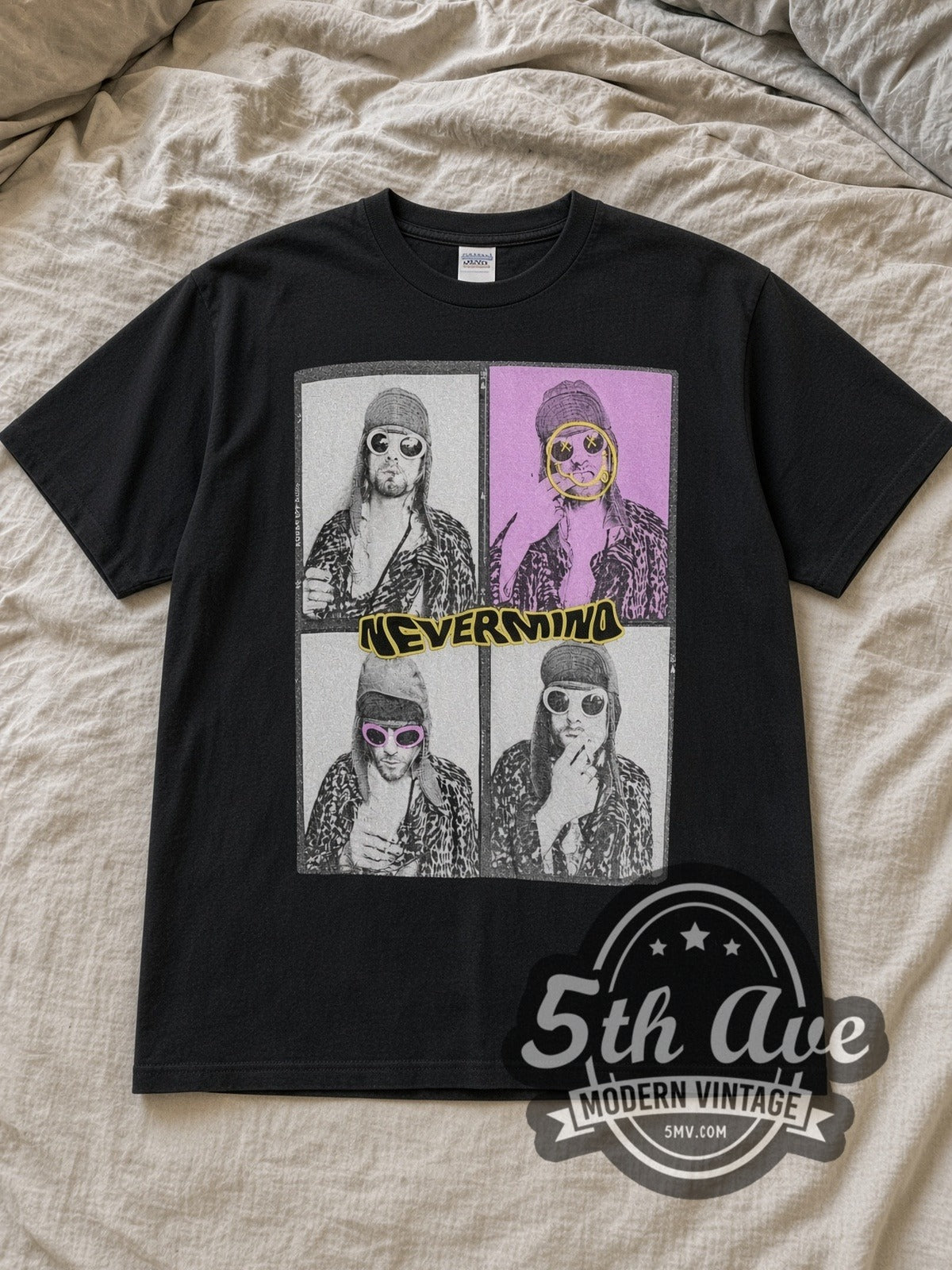 Black Nirvana Nevermind Four Panel Kurt Leopard Grid Vintage Band T-Shirt laid flat on a linen bed