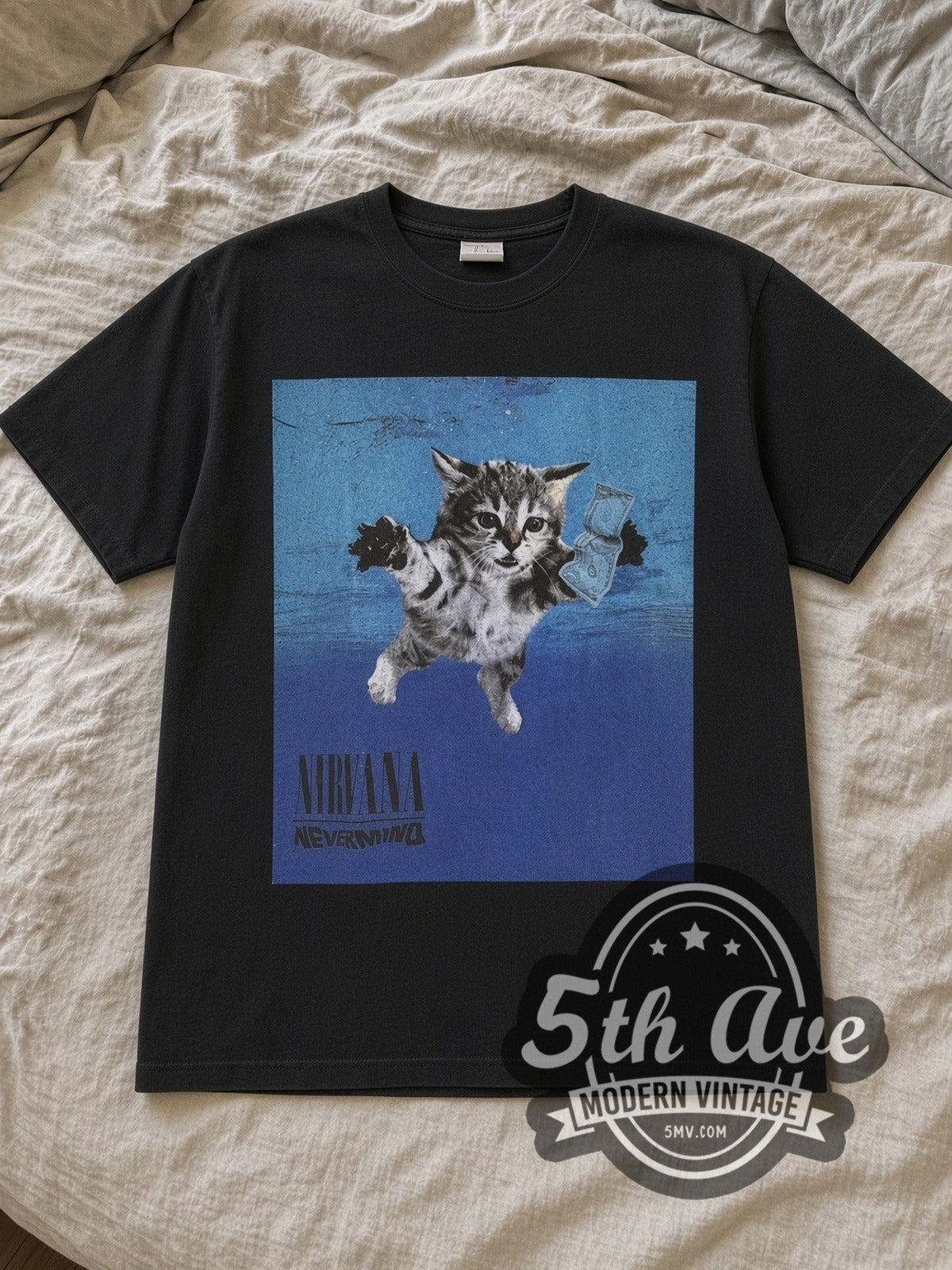Black Nirvana Nevermind Kitten Parody Cat Breeds Black Vintage Band T-Shirt laid flat on a linen bed